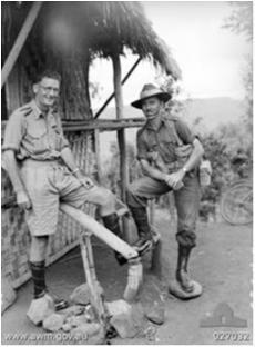 MAJOR A. G. CAMERON, ACTING COMMANDING OFFICER OF THE 39TH AUSTRALIAN INFANTRY BATTALION (RIGHT) AND CHAPLAIN FOURTH CLASS REVEREND N. J. KARL, PADRE OF THE BATTALION (LEFT).